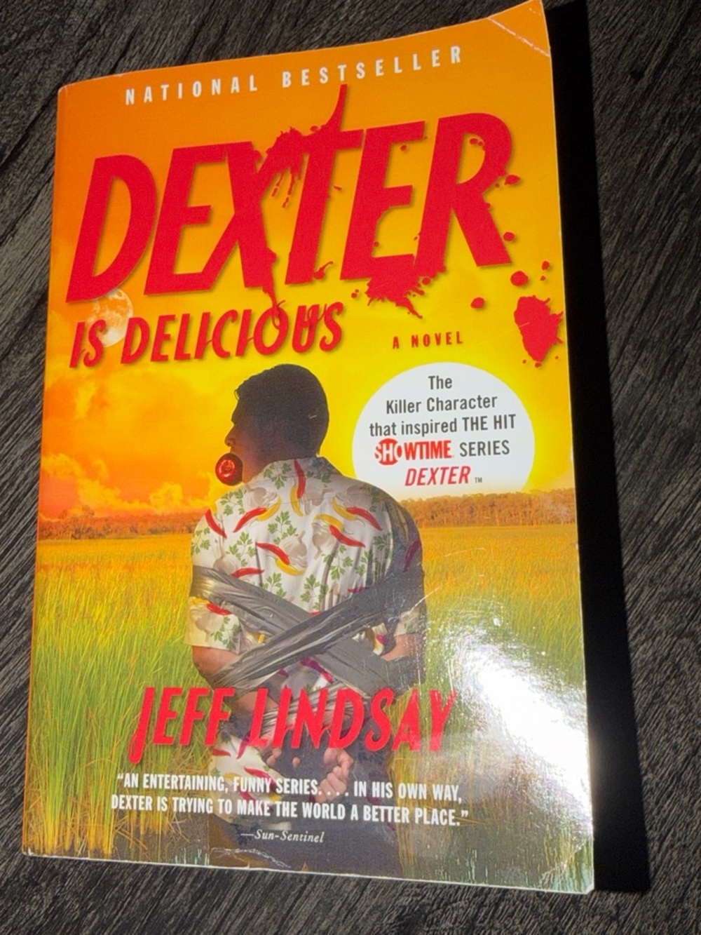 Dexter Is Delicious by Jeff Lindsay - Bright Orange Cover Paperback
